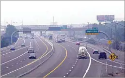  ?? SCOTT SONNER / AP ?? In this Aug. 19, 2020, file photo, smoke from California wildfires up to 200 miles away is seen on Interstate 80 looking west in Sparks, Nev.