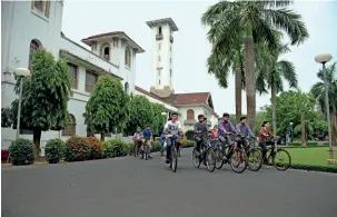  ?? SUBIR HALDER ?? PEDALLING SUCCESS Students cycle past the old block at the institute