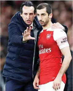  ?? — Reuters photo ?? Arsenal manager Unai Emery (left) speaks to Henrikh Mkhitaryan during the English Premier League match against Newcastle United at Emirates Stadium in London, Britain in this April 1 file photo.