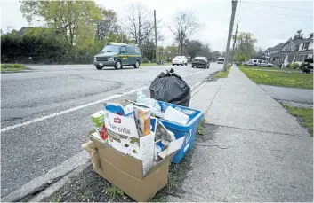  ?? JULIE JOCSAK/POSTMEDIA NEWS ?? Garbage sits on the boulevard in the east end of St. Catharines on Wednesday.