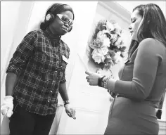  ??  ?? Brightview West End resident assistant Hannah Asuakyi, left, begins her virtual dementia tour by listening to instructio­ns from Albina Misini.