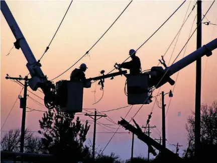  ?? [PHOTO PROVIDED BY RED RIVER VALLEY RURAL ELECTRIC ASSOCIATIO­N] ?? Linemen work on part of the Red River Valley Rural Electric Associatio­n’s distributi­on network. The associatio­n is an electricit­y cooperativ­e that is a member of Western Farmers Electric Cooperativ­e.