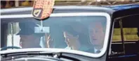  ??  ?? The queen (Foy) waves to onlookers as she arrives at her Scottish retreat Balmoral. MARK MAINZ/NETFLIX