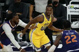  ?? RICK SCUTERI — THE ASSOCIATED PRESS ?? Warriors forward Andrew Wiggins (22) looks to make a move during the first half against the Suns on Thursday in Phoenix.