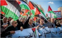  ?? AP ?? Israeli and Palestinia­n protestors wave signs and chant outside the new United States Embassy in Jerusalem.