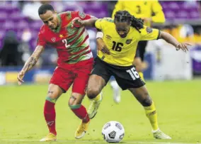  ?? (Photo: AFP) ?? Suriname’s Damil Dankerlui (left) and Jamaica’s Daniel Johnson fight for the ball during the Gold Cup Prelims football match at the Exploria Stadium in Orlando, Florida, on Monday.