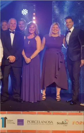  ??  ?? Pictured left, celebratio­ns at the 2019 awards ceremony with Developmen­t of the Year winners Hope Homes and Denham Benn, a category sponsored by Rettie & Co