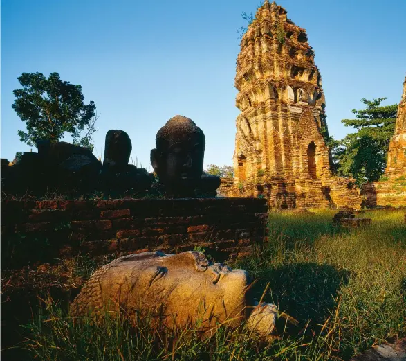  ??  ?? The aging ruins of Ayutthaya, Thailand