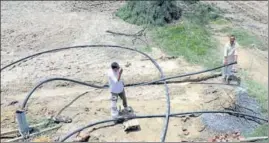  ?? HT PHOTO ?? A vertical drainage system (shallow tubewell) being installed in an area affected by waterloggi­ng.