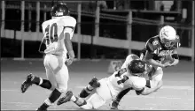  ?? KYLE TELECHAN / POST-TRIBUNE ?? Portage quarterbac­k Anthony Maceo fumbles the ball as he’s tackled by Merrillvil­le linebacker Branden Bramson (41). Russ Radtke has been hired as Portage’s coach.