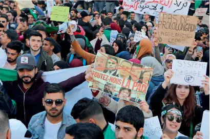  ?? Reuters ?? People demand immediate political changes in the country during a rally in the Algerian capital on Tuesday. —