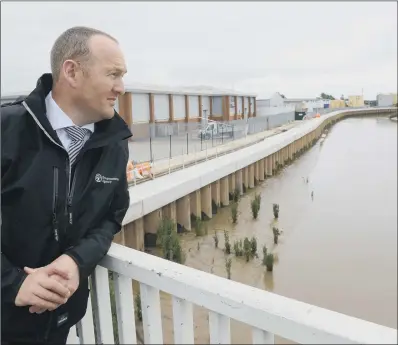  ??  ?? Environmen­t Agency project manager Brendan Sharkey with the new River Hull flood defences.