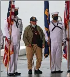  ?? (AP/Marco Garcia) ?? A veteran stands with the military color guard before the start of the 80th Pearl Harbor Anniversar­y ceremony.