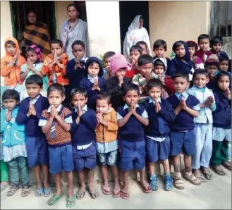  ?? Photo contribute­d ?? Children gather at the daycare in Krishna Nagar, Delhi, which is supported by the East Meets West Children’s Foundation, a local organizati­on.