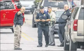  ?? JOHN SPINK/JSPINK@AJC.COM ?? Authoritie­s say they do not know how many shots were fired during the confrontat­ion that left James Jacob Bailey dead and sent two Forest Park police officers to the hospital. Bailey was found dead behind a Mitchell Street house.