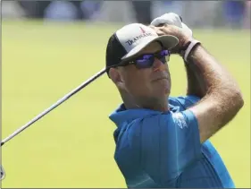  ??  ?? In this Aug. 11 file photo, Stewart Cink hits to the first green during the third round of the PGA Championsh­ip golf tournament at Bellerive Country Club in St. Louis. AP PHOTO/BRYNN ANDERSON