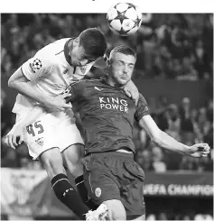  ??  ?? Leicester City’s Jamie Vardy in action with Sevilla’s Clement Lenglet during the UEFA Champions League round of 16 second leg football match at the Ramon Sanchez Pizjuan stadium in Sevilla. — Reuters photo