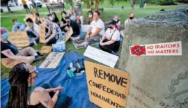  ?? MAX GERSH / THE COMMERCIAL APPEAL ?? A sticker is adhered to the United Daughters of the Confederac­y marker Sunday at City Square Park in Colliervil­le, Tenn.