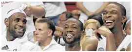  ?? MICHAEL LAUGHLIN/SOUTH FLORIDA SUN SENTINEL ?? From left: It was all smiles for LeBron James, Dwyane Wade and Chris Bosh in 2012-13.