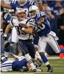  ?? MATTHEW WEST / BOSTON HERALD ?? SLIPPING TACKLES: New England’s Wes Welker had a slew of Colts chasing him down as he runs for 35 yards on a punt return in the New England Patriots’ 24-20 win over the Indianapol­is Colts on Sunday, November 4, 2007.