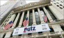  ?? MARK LENNIHAN — THE ASSOCIATED PRESS ?? A banner for Utz Brands snacks, which is listed at the New York Stock Exchange, hangs outside the building Monday in New York.