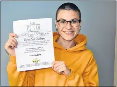  ??  ?? Hillary Wood, president of Veg P.E.I., holds the poster for Veg It Up, the Vegan Food Challenge that continues until Oct. 4 on P.E.I. She’s encouraged with how much the program has caught on. “It’s growing every year. For the first two years we had 14. This year we have 21 restaurant­s participat­ing. It makes me feel hopeful.”