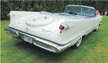  ?? PHOTOS: ALYN EDWARDS ?? Gunsight tail lights mounted on rear fins and an imitation tire cover characteri­zed the 1958 Imperial Crown convertibl­e as Chrysler’s top luxury model of the era.