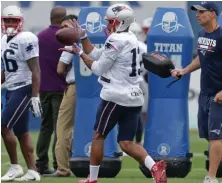  ?? STAFF PHOTO BY JOHN WILCOX ?? ON THE BALL: Receiver Devin Lucien makes a catch during yesterday’s practice.