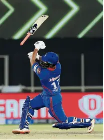 ?? SPORTZPICS / IPL ?? Mighty swing: The bat slips out of Pant’s hands during Capitals’ chase of 166 against Punjab. Backed by Shikhar Dhawan’s solid unbeaten 69, Capitals trotted home in 17.4 overs.