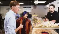  ?? Arnold Gold / Hearst Connecticu­t Media ?? From left, New Haven Mayor Justin Elicker gets some ordering advice from U.S. Rep. Rosa DeLauro as Marc D'Angelo, co-owner of Libby's Italian Pastry Shop, takes his order after a ribbon cutting ceremony celebratin­g the 100th anniversar­y of the Wooster Street bakery cafe in New Haven on Wednesday.