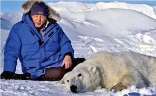  ??  ?? Dedication: Sir David filming 2011’s Frozen Planet – with a polar bear