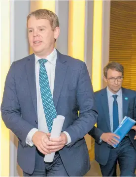  ?? Photo / Mark Mitchell ?? Health Minister Chris Hipkins (left) and director general of health Dr Ashley Bloomfield after their Covid-19 media update at Parliament yesterday.