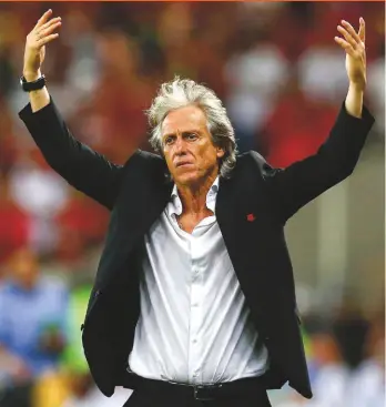  ??  ?? Glory...Jorge Jesus won the Brazilian league title and the Copa Libertador­es