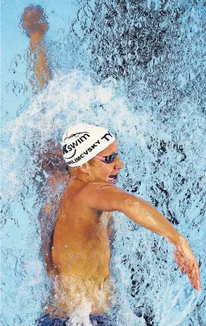  ?? TOM PENNINGTON/GETTY CLIVE BRUNSKILL/GETTY ?? Jordan Wilimovsky competes in a preliminar­y heat for the 1,500-meter freestyle during the U.S. swimming trials.
The United States’ Rajeev Ram, partnering with Joe Salisbury of Great Britain, plays a forehand in their men’s doubles semifinal match against Nikola Mektic and Mate Pavic of Croatia at Wimbledon on July 8 in London.