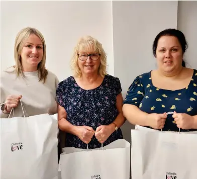  ?? ?? Clothed in Love founder Alison Hastings (centre) with her daughter Sara (left) and volunteer Kirsty Duncan