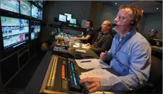  ?? BARRY GRAY, THE HAMILTON SPECTATOR ?? Burlington’s Doug Walton working in the truck producing the Blue Jays broadcast for SportsNet.