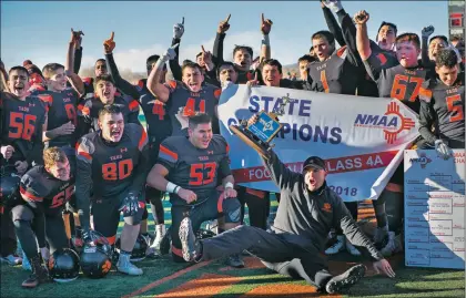  ?? Morgan Timms/The Taos News ?? Taos Tigers react to their state championsh­ip title Saturday (Dec. 1) at Anaya Field in Taos.