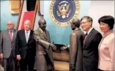  ?? CHANG JUN / CHINA DAILY ?? Liu Jian (second from right), Chinese consul general in Los Angeles, poses on Tuesday in front of the statue depicting the historic handshake between US President Richard Nixon and Chinese Premier Zhou Enlai in 1972. Joining Liu are (from left): Bill...
