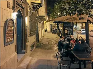  ??  ?? Bars and eateries in Santiago’s Lastarria neighbourh­ood stay open late into the night as Chileans digest the performanc­e of the nation’s football team.