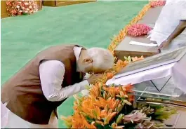  ?? — via web ?? Prime Minister Narendra Modi bows to Constituti­on of India at Parliament’s Central Hall on Saturday.