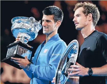  ?? Photo: REUTERS ?? Still mates: A disappoint­ed runner-up, Andy Murray, as Novak Djokovic yet again clutches the Australian Open men’s singles trophy.