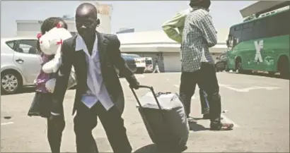  ?? PHOTO: GETTY IMAGES ?? South Sudanese refugees on their way to Ben Gurion airport for the first repatriati­on flight this week