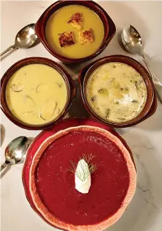  ?? St. Louis Post Dispatch/TNS ?? ■ A selection of summer soups, at top: Sweet Pea soup, middle row: Asparagus and Shiitake Mushroom soup, left, and Cream of Zucchini and Almond soup, bottom: Beet-Fennel-Ginger soup.