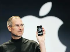  ?? PAUL SAKUMA / THE ASSOCIATED PRESS FILES ?? In this 2007 file photo, the late Apple CEO Steve Jobs holds up the new iPhone at MacWorld Conference.