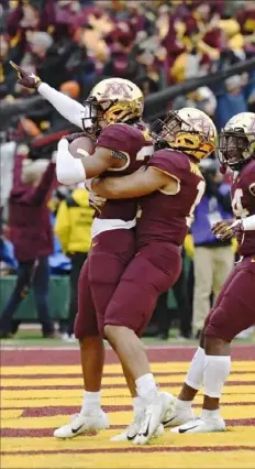  ??  ?? Minnesota celebrates a crucial intercepti­on of Penn State’s Sean Clifford late in the fourth quarter Saturday at TCF Bank Stadium in Minneapoli­s.