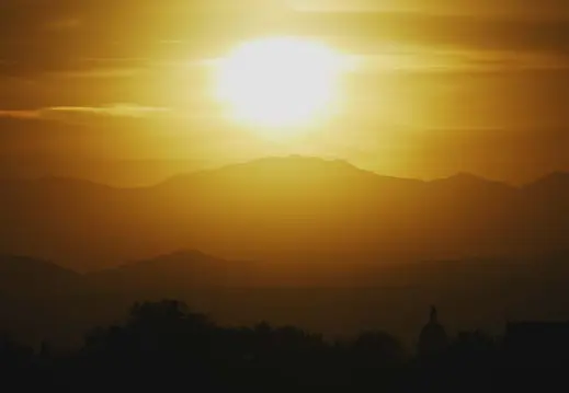  ?? Photos by Hyoung Chang, The Denver Post ?? The sun sets on Mount Evans on Wednesday. The 14,265-foot peak is named for John Evans, a territoria­l governor who was forced to resign in the wake of the Sand Creek Massacre of 1864. The U.S. Board on Geographic Names is looking at other possible names for the mountain.