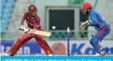  ??  ?? LUCKNOW: West Indies’ Nicholas Pooran (L) plays a shot during the second one day internatio­nal (ODI) cricket match between Afghanista­n and West Indies at the Ekana Cricket Stadium in Lucknow yesterday. — AFP