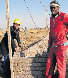  ?? /Supplied ?? Multifacet­ed: Melita Molobane Mohlala, owner of Molobane Estate Lodge and Spa on the West Rand, and an employee at one of her numerous constructi­on sites.