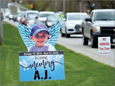  ??  ?? Cars line up as mourners head to visitation services for AJ Freund, 5, on May 3, 2019 at Davenport Funeral Home in Crystal Lake, Ill. (AP Photo)