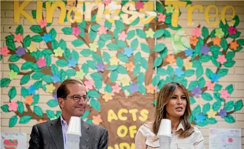  ?? AP ?? First lady Melania Trump, right, accompanie­d by Health and Human Services Secretary Alex Azar, left, speaks at a roundtable at the Upbring New Hope Children Centre run by the Lutheran Social Services of the South in McAllen, Texas, yesterday.
